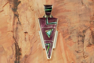 Genuine Purple Spiny Oyster Shell and Black Jade inlaid between ribbons of Sterling Silver. Beautiful Pendant features Fire and Ice Lab Opal Accents. Precision inlay on the bale and pendant. Free 18